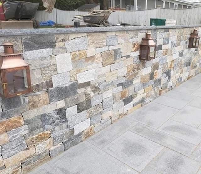 Stone wall with copper lighting