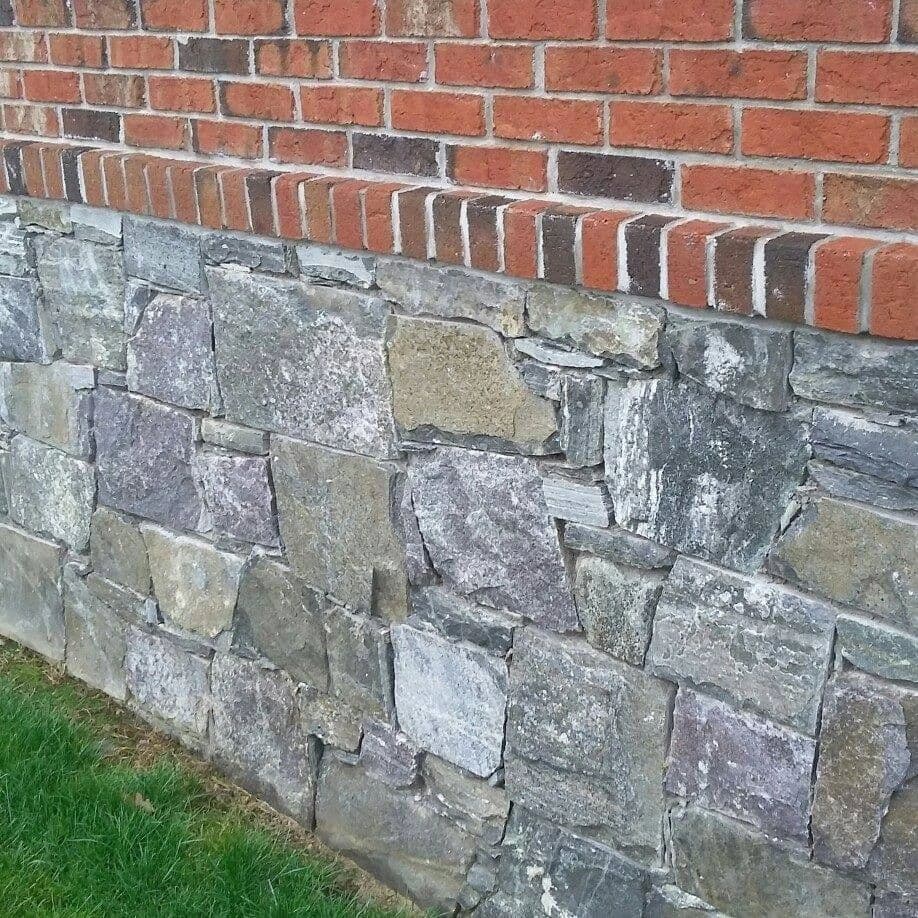 Natural stone veneer wall